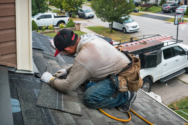 Professional Roofing technician working in Roosevelt, NY